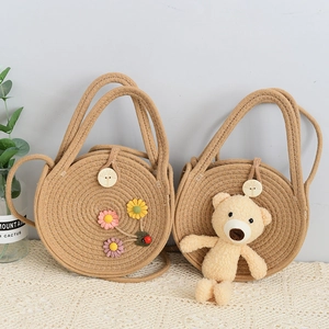 Handmade woven straw crossbody bags with cute floral patterns and plush bear charms