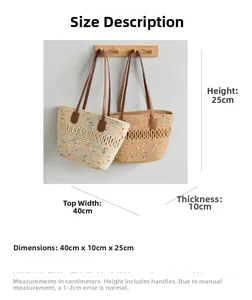 Detailed view of woven straw tote bag with dimensions and colorful pompom accents