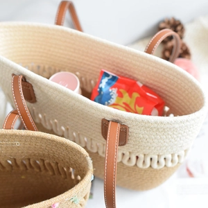 Detailed macro view of woven tote bag texture with leather handle and large capacity
