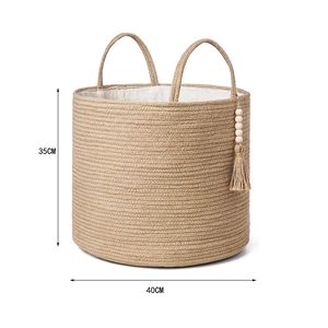Detail view of woven storage basket with tassels and 35cm by 40cm dimensions