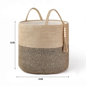 Detail of woven cotton rope storage basket with dual handles and wooden bead tassels