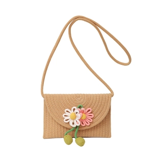 Straw woven crossbody bag for kids featuring knitting flowers and a khaki texture