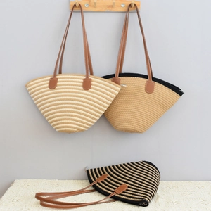 Detail of hand-woven cotton thread beach shoulder bags in striped and solid patterns