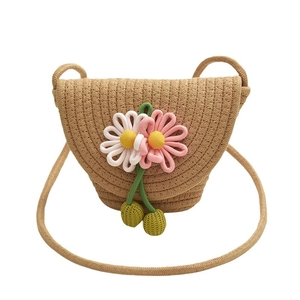 Charming woven straw crossbody bag for girls featuring handmade 3D floral decorations