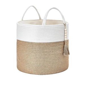 Two-tone woven cotton rope storage basket with decorative tassels and dual handles