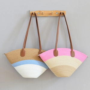 Bohemian woven shoulder bag with color-block pattern and brown leather straps