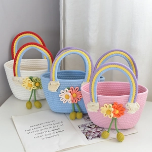 Handmade cotton rope woven handbag with rainbow handles and crochet flower decor