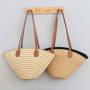 Two large hand-woven cotton thread tote bags with brown shoulder straps for travel