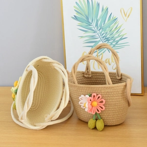 Handmade woven straw beach bag with 3D floral accents in beige and light brown