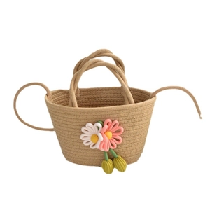 Handwoven straw beach bag with floral crochet ornaments and sturdy dual handles
