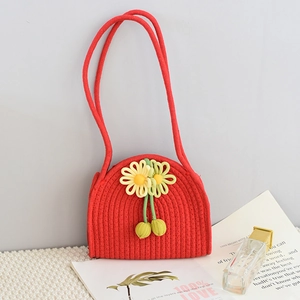 Handmade red cotton rope woven crossbody bag with floral ornaments and cherry charms