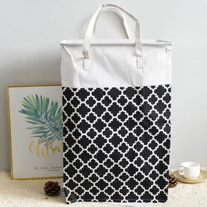 Close-up of geometric pattern laundry basket with reinforced handles for easy carrying