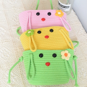 Three-tier cartoon hanging storage baskets in pink, yellow and green woven cotton rope
