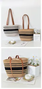 Detailed view of woven tote bags featuring striped patterns and brown PU leather handles