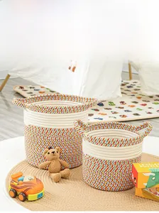 Close-up of bohemian hand-woven cotton baskets with speckled texture and sturdy handles