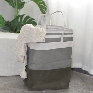 Large striped laundry basket in grey and green with sturdy handles for home storage