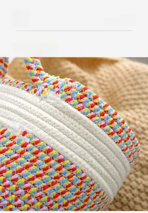 Macro shot of colorful bohemian hand-woven cotton storage basket with tight spiral texture