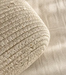 Detailed macro view showing the tight woven texture of the cream white cotton tote bag