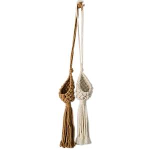 Handmade macrame air plant hangers in brown and beige with tassels for wall decor