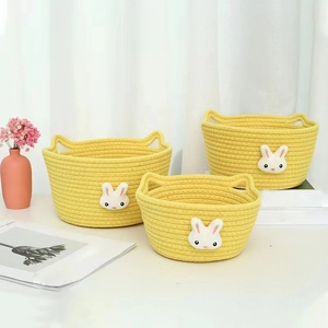 Set of 3 yellow woven cotton rope storage baskets with cute white plush rabbit designs
