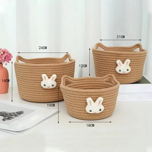 Three-piece set of khaki woven cotton rope storage baskets with bunny patches and cat-ear handles
