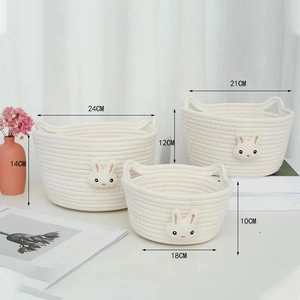 Three-piece nesting set of woven cotton rope baskets with cute 3D bunny design details