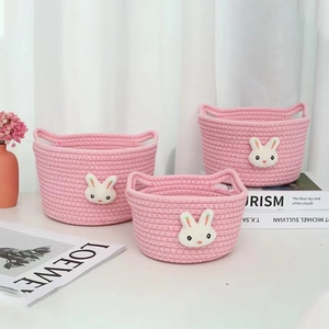 Three-piece set of pink woven cotton rope storage baskets with cute bunny ear design