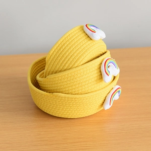 Three-piece yellow woven cotton rope storage basket set with rainbow cloud embroidery detail