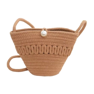 Handmade woven bucket bag with elegant pearl closure and dual rope handles on white background