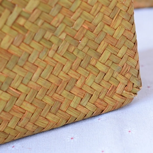 Close-up of tight hand-woven seagrass texture and detailed natural fiber craftsmanship