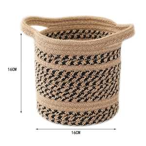 Detail view of a 16cm round woven cotton rope storage basket with dual handles