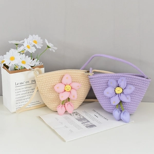 Detail of hand-woven mini bucket bags in beige and purple with cute floral accents