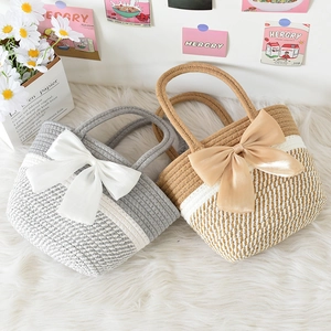Handmade striped cotton woven handbag with large satin bow for summer beach vacation