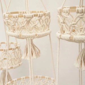 Close-up of handmade macrame fruit basket with woven cotton rope and tassels