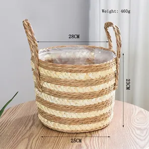 Detail of hand-woven straw basket with dual handles and waterproof plastic liner