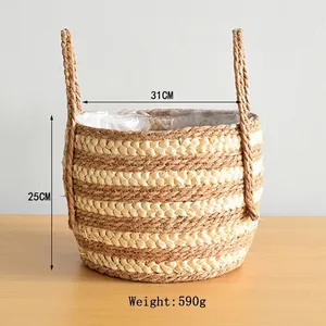 Detailed view of woven seagrass plant basket with dual handles and plastic liner