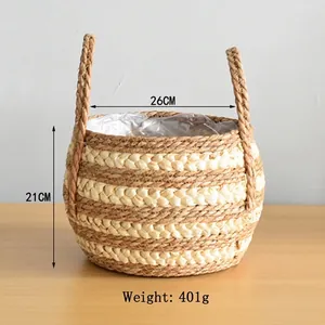 Detail of woven straw basket with dual handles and dimensions of 26cm width and 21cm height