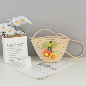 Mini woven cotton bucket bag with rainbow stripes and floral decor for beach summer