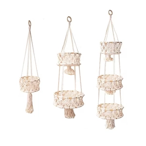 Handwoven macrame hanging fruit baskets in three sizes with white cotton rope and tassels