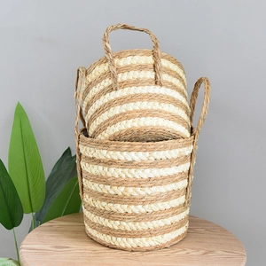 Macro shot of striped woven plant baskets with handles for Nordic home decor