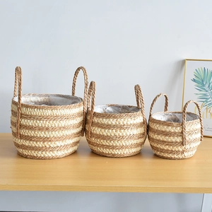 Three-piece seagrass plant basket set with dual handles and waterproof plastic lining