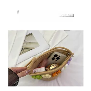 Internal view showing large capacity for phone and cosmetics in woven handmade bag