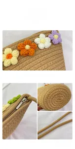 Detail of handmade woven crossbody bag featuring colorful crochet flowers and metal zipper