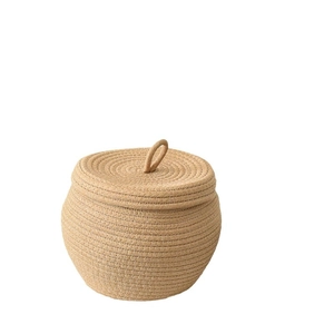 Handwoven cotton rope storage basket with lid in natural beige round pumpkin shape