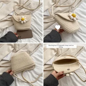 Detail view of woven daisy phone bag with magnetic closure and spiral knit texture