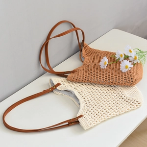 Detail showing woven mesh texture, leather straps and vintage rivets of the tote bag