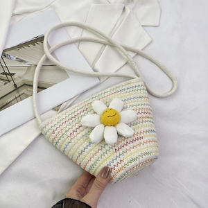 White woven crossbody bag with colorful stitching and large daisy flower smiley detail