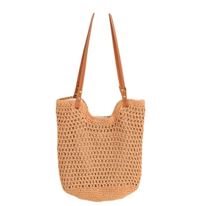 Large woven beach tote bag with brown leather handles and natural hollow mesh design