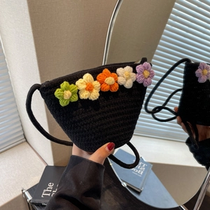 Handmade black crochet crossbody bag featuring colorful 3D knitted flowers for summer