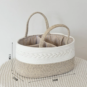 Detail view of woven cotton rope basket with striped lining and three storage compartments
